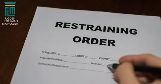 Someone completing a restraining order document